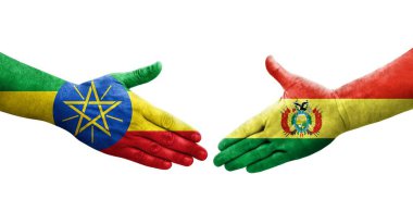 Ellerine bolivya ve Etiyopya bayrakları arasında el sıkışma, izole şeffaf görüntü.