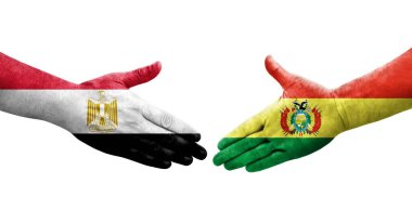 Bolivya ve Mısır bayrakları arasındaki el sıkışma ellerinde izole şeffaf görüntü.