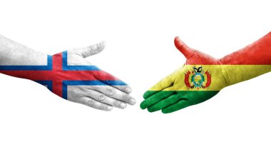Ellerine bolivya ve Faroe Adaları bayrakları arasında el sıkışma, izole şeffaf görüntü.