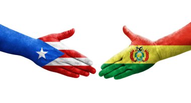 Bolivya ve Porto Riko bayrakları arasındaki el sıkışma ellerinde izole şeffaf görüntü.