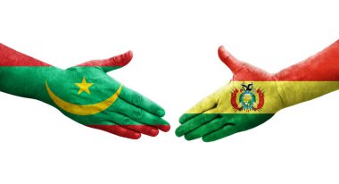 Ellerinde Bolivya ve Moritanya bayrakları arasında el sıkışma, izole şeffaf görüntü.