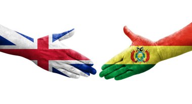 Bolivya ve Büyük Britanya bayrakları arasındaki el sıkışma ellerinde resmedilmiş şeffaf görüntü.