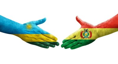 Bolivya ve Ruanda bayrakları arasındaki tokalaşma elleri boyalı, izole şeffaf görüntü.