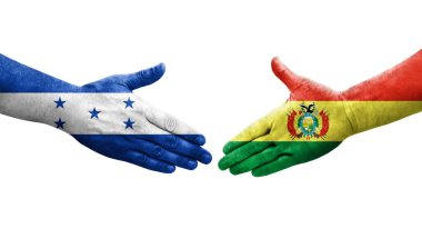 Ellere bolivya ve Honduras bayrakları arasında el sıkışma, izole şeffaf resim.