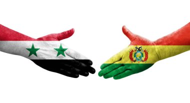 Ellerine bolivya ve Suriye bayrakları arasında el sıkışma, izole şeffaf görüntü.