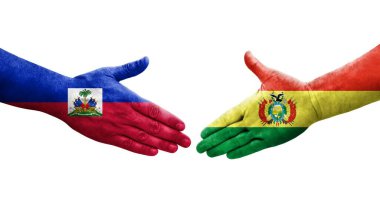Bolivya ve Haiti bayrakları arasındaki el sıkışma ellerinde izole şeffaf görüntü.