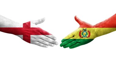 Bolivya ve İngiltere bayrakları arasındaki el sıkışma ellerinde resmedilmiş şeffaf görüntü.