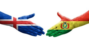 Bolivya ve İzlanda bayrakları arasındaki el sıkışma ellerinde izole şeffaf görüntü.