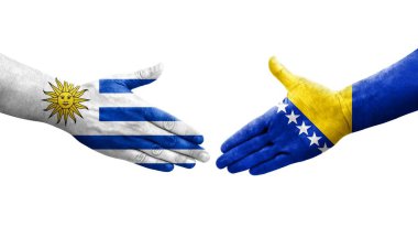 Bosna ve Uruguay bayrakları arasındaki el sıkışma, izole şeffaf görüntü.