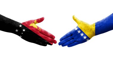 Bosna-Papua Yeni Gine bayrakları arasında el sıkışma, izole şeffaf görüntü.