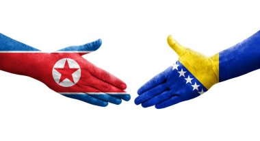 Bosna ve Kuzey Kore bayrakları arasında el sıkışma, izole şeffaf görüntü.