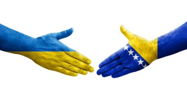 Bosna ve Ukrayna bayrakları arasında el sıkışma, izole şeffaf görüntü.