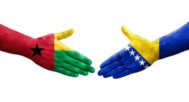 Bosna ve Gine Bissau bayrakları arasındaki el sıkışma, izole şeffaf görüntü.
