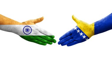 Bosna ve Hindistan arasındaki el sıkışma ellerinde boyanmış bayraklar, izole şeffaf görüntü.