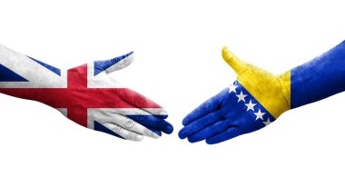 Bosna ve İngiltere arasındaki el sıkışma ellerinde bayraklar, izole edilmiş şeffaf görüntü.