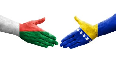Bosna ve Madagaskar bayrakları arasındaki el sıkışma, izole edilmiş şeffaf görüntü.