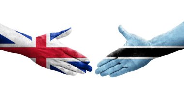 Botswana ve Büyük Britanya bayrakları arasındaki el sıkışma ellerinde resmedilmiş şeffaf görüntü.