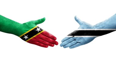 Botswana ve Saint Kitts ve Nevis bayrakları arasındaki el sıkışma, izole şeffaf görüntü.