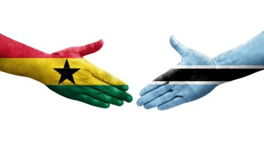 Botswana ve Gana bayrakları arasındaki el sıkışma ellerinde resmedilmiş şeffaf görüntü.