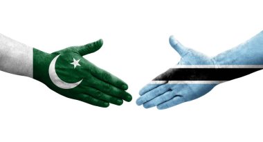 Botswana ve Pakistan bayrakları arasında el sıkışma, izole şeffaf görüntü.