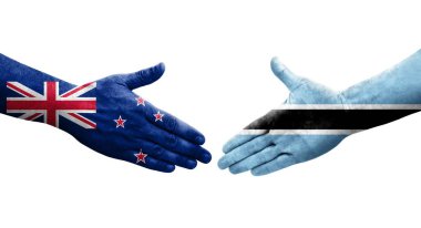 Botswana ve Yeni Zelanda bayrakları arasında el sıkışma, izole şeffaf görüntü.