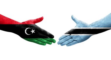 Botswana ve Libya bayrakları arasındaki el sıkışma, izole saydam görüntü.