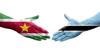 Botswana ve Surinam bayrakları arasında el sıkışma, izole şeffaf görüntü.