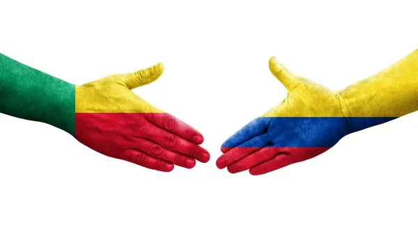 stock image Handshake between Benin and Colombia flags painted on hands, isolated transparent image.