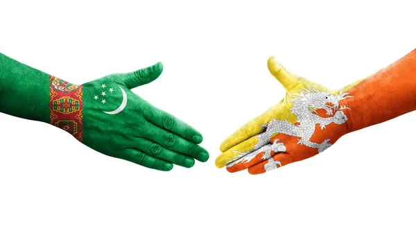 Handdruk Tussen Bhutan Turkmenistan Vlaggen Geschilderd Handen Geïsoleerd Transparant Beeld — Stockfoto