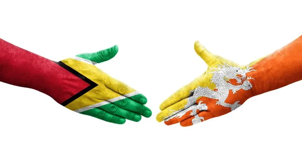Handslag Mellan Bhutan Och Guyana Flaggor Målade Händer Isolerad Transparent — Stockfoto