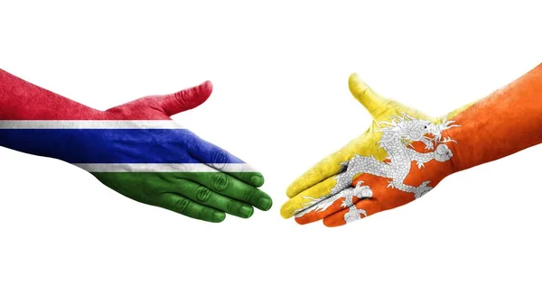 Handshake Entre Butão Gâmbia Bandeiras Pintadas Mãos Imagem Transparente Isolada — Fotografia de Stock