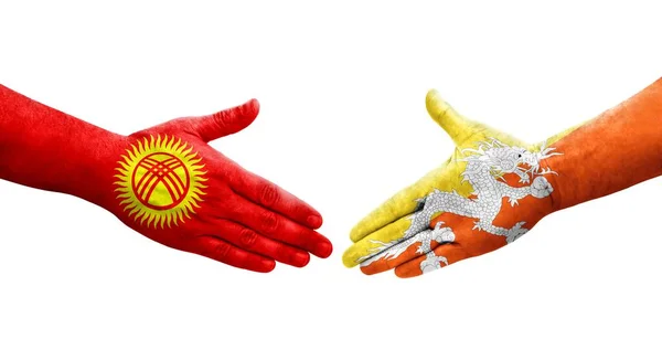 Handdruk Tussen Bhutan Kirgizië Vlaggen Geschilderd Handen Geïsoleerd Transparant Beeld — Stockfoto