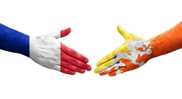 不丹和法国之间的握手手绘国旗 孤立透明的形象 — 图库照片