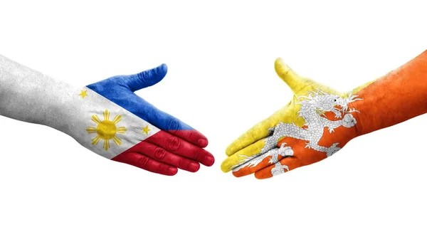 Uścisk Dłoni Między Flagami Bhutanu Filipin Namalowany Rękach Odizolowany Przezroczysty — Zdjęcie stockowe