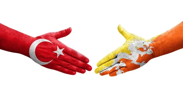 不丹和土耳其之间握手 手绘国旗 孤立透明的形象 — 图库照片