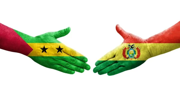 stock image Handshake between Bolivia and Sao Tome and Principe flags painted on hands, isolated transparent image.