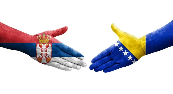 Handdruk Tussen Bosnische Servische Vlaggen Handen Geschilderd Geïsoleerd Transparant Beeld — Stockfoto