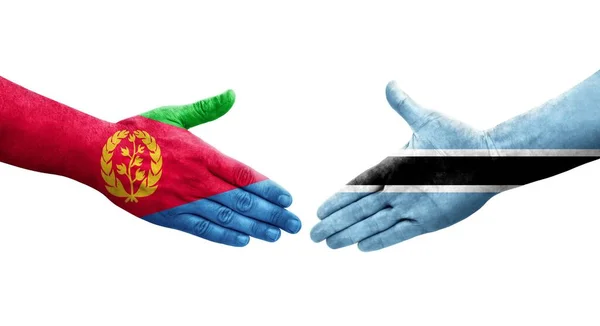 stock image Handshake between Botswana and Eritrea flags painted on hands, isolated transparent image.