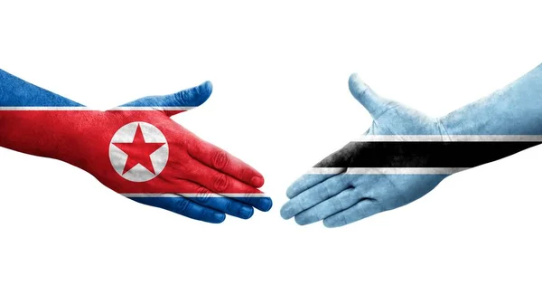 Aperto Mão Entre Botsuana Bandeiras Coreia Norte Pintadas Mãos Imagem — Fotografia de Stock
