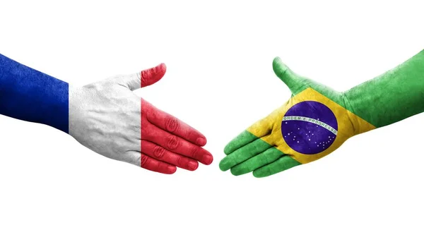 手に描かれたブラジルとフランスの旗の間の握手 隔離された透明なイメージ — ストック写真