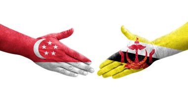 Brunei ve Singapur bayrakları arasındaki el sıkışma ellere boyanmış, izole şeffaf görüntü.