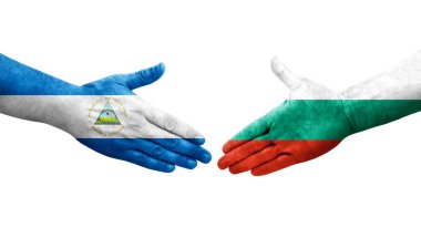 Bulgaristan ile Nikaragua bayrakları arasındaki el sıkışma, izole şeffaf görüntü.