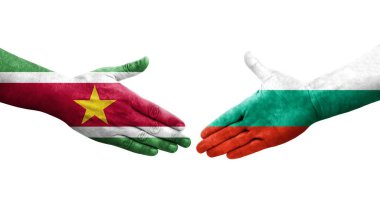 Bulgaristan ile Surinam bayrakları arasındaki el sıkışma, izole saydam görüntü.