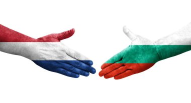 Bulgaristan ile Hollanda arasındaki el sıkışma, elde boyanmış bayraklar, izole edilmiş şeffaf görüntü.