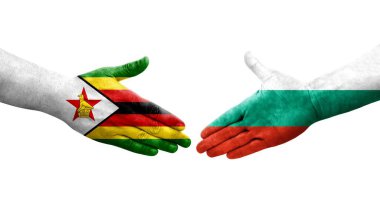 Bulgaristan ile Zimbabwe bayrakları arasındaki el sıkışma, izole şeffaf görüntü.