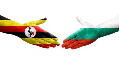 Bulgaristan ile Uganda bayrakları arasındaki el sıkışma, izole edilmiş şeffaf görüntü.