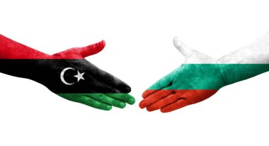 Bulgaristan ile Libya bayrakları arasındaki el sıkışma, izole edilmiş şeffaf görüntü.