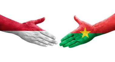 Ellerinde Burkina Faso ve Monako bayrakları arasında el sıkışma, izole şeffaf görüntü.