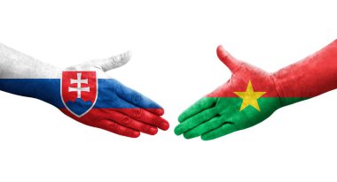 Ellerinde Burkina Faso ve Slovakya bayrakları arasında el sıkışma, izole şeffaf görüntü.
