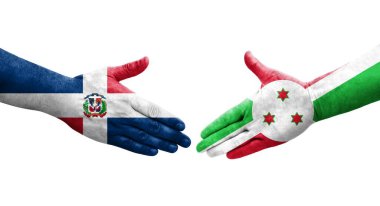Burundi ve Dominik Cumhuriyeti bayrakları arasındaki el sıkışma, izole şeffaf görüntü.